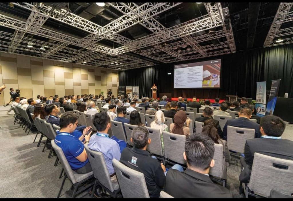 UCO annual conference session with audience and presentation screen